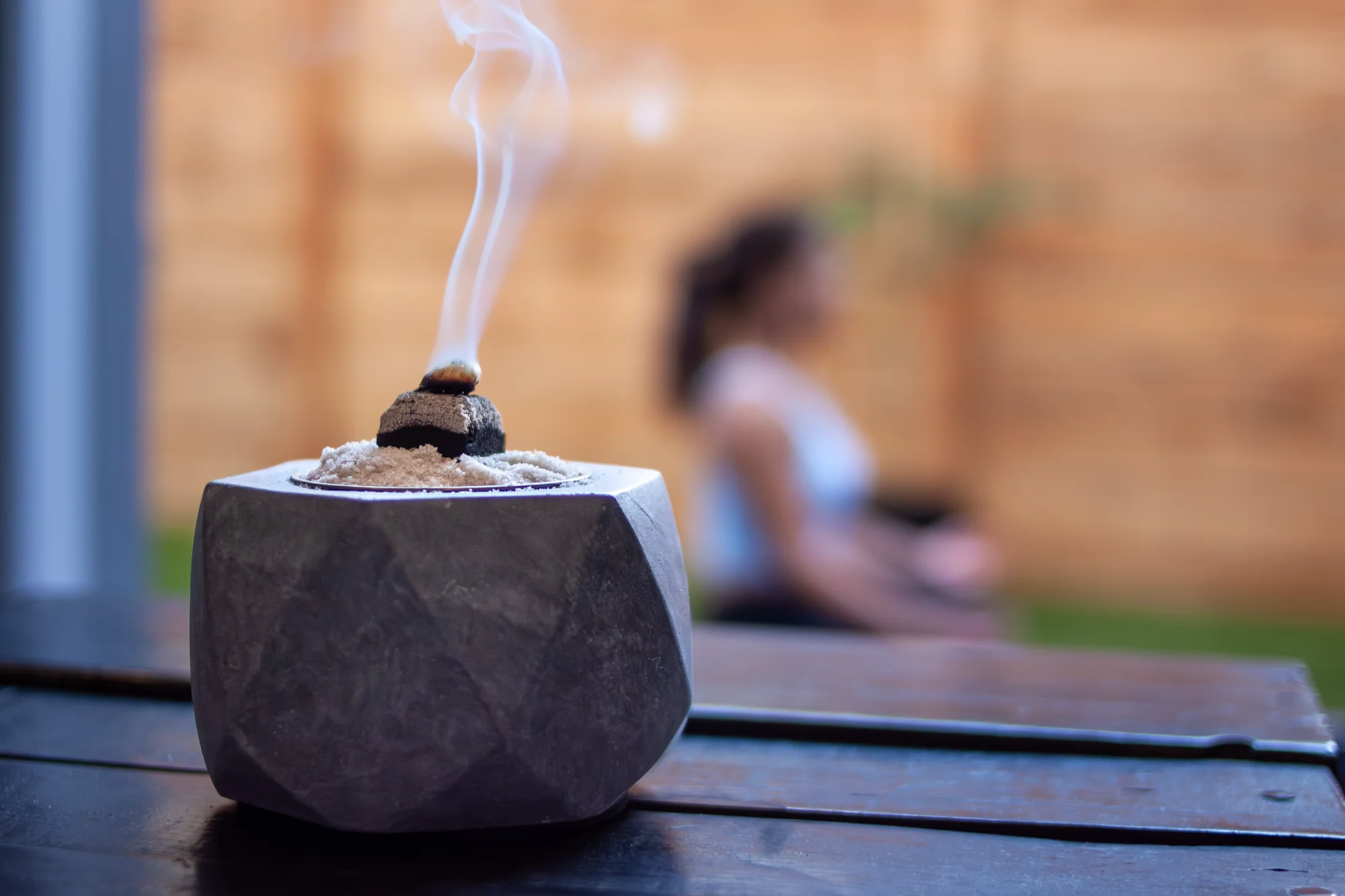 Traditional incense burner with smoke rising